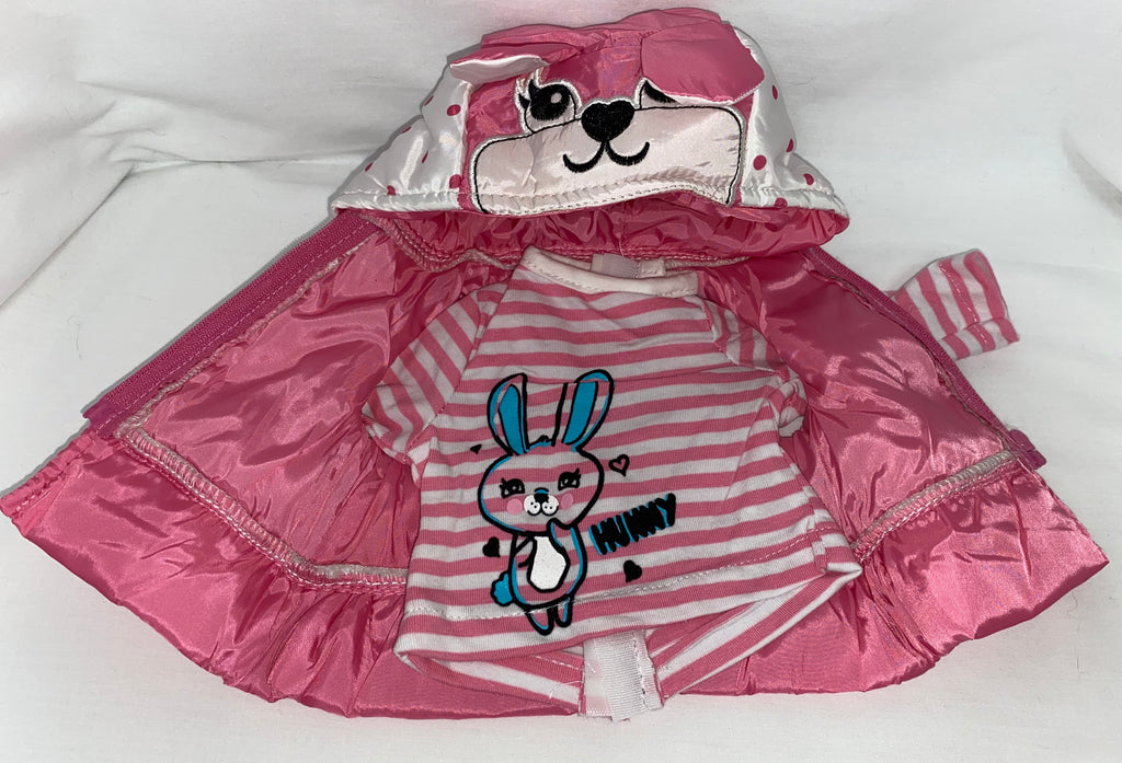 Flat lay of pink satin puffer vest and pink and white striped bunny graphic shirt for 18 inch dolls, showing quilted vest with bunny face embroidered hood and attached ruffle hem