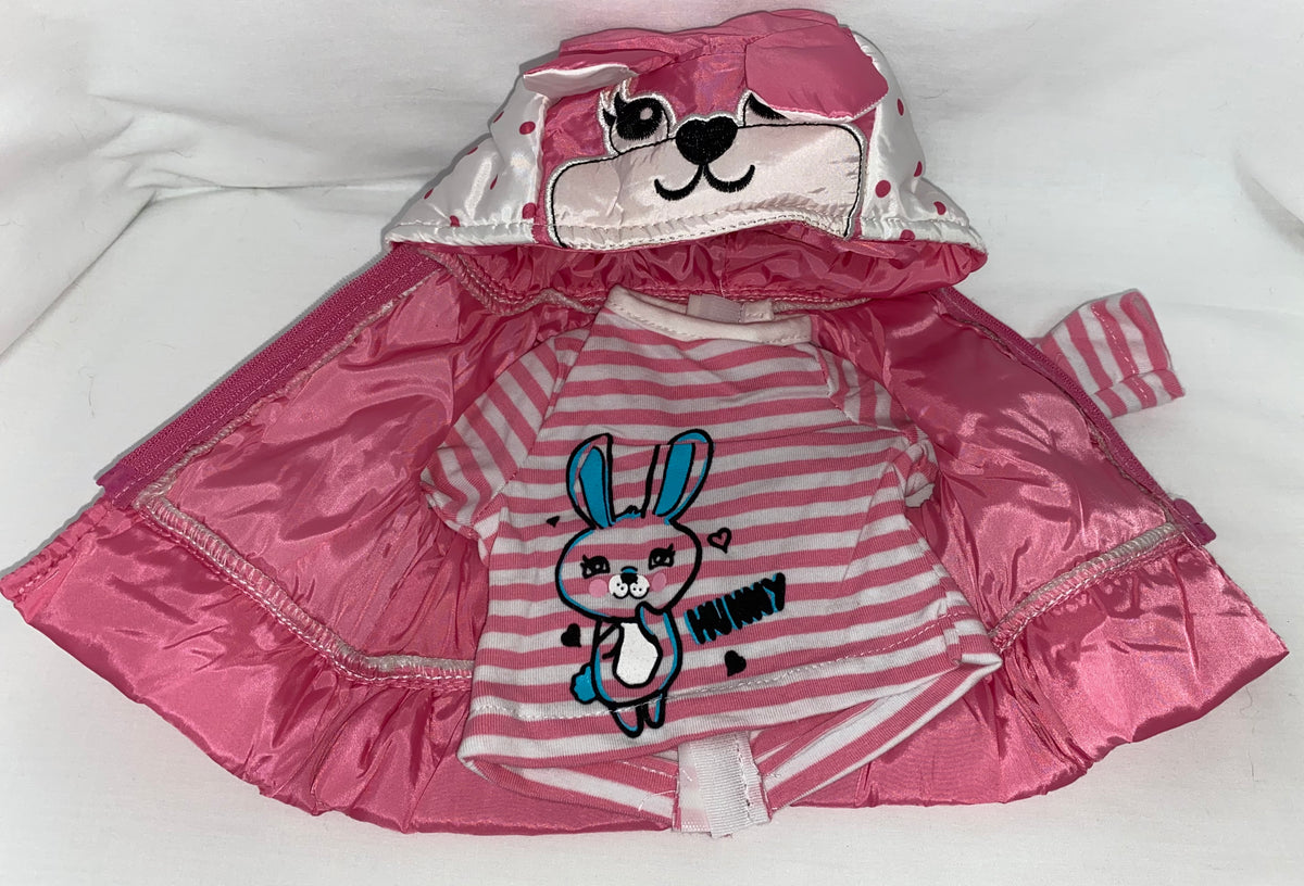 Flat lay of pink satin puffer vest and pink and white striped bunny graphic shirt for 18 inch dolls, showing quilted vest with bunny face embroidered hood and attached ruffle hem